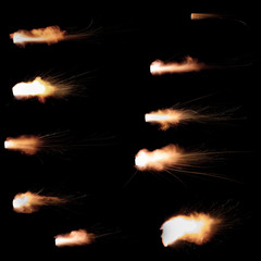 Wall Mural - Texture of firearm shot with bright flash of light, sparks, smoke and gunpowder gases on black background