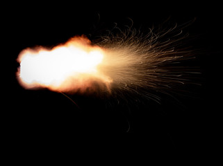 Wall Mural - Texture of firearm shot with bright flash of light, sparks, smoke and gunpowder gases on black background