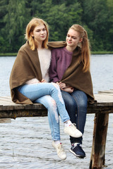 two young girls relax together