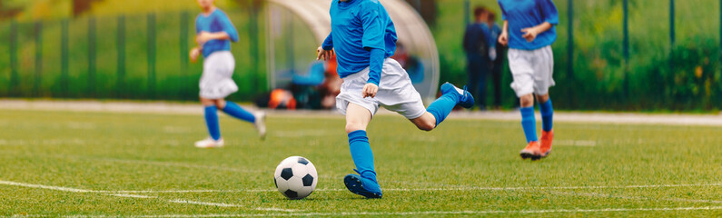 Kids Play Soccer Game. Children Outdoor Football Tournament Match on Grass Field