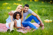 © NDABCREATIVITY - Picture of lovely couple with their daughter having picnic