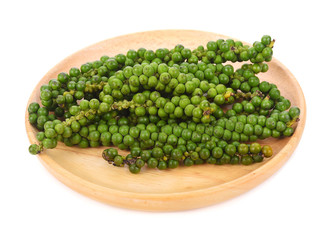 Wall Mural - Fresh green peppercorns on white background