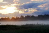 Fototapeta Na ścianę - Sunset in the fog on a summer evening