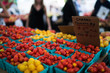 © eskstock - In paper containers packed tomatoes cherry ready for sale in a vegetable farmer's market. Tomatoe grapes on display at the market. Eco product. Ecology and preservation of the environment concept.