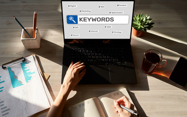Wall Mural - Keywords. SEO, Search engine optimization and internet marketing concept on screen.