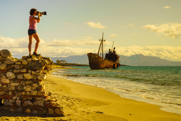 Wall Mural - Tourist take photo on beach sea shore