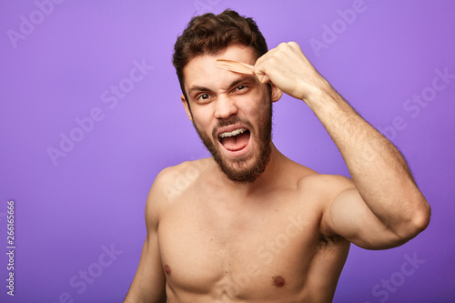 Crazy Funny Man Doing Depilation On His Face Close Up Portrait