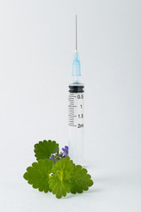 Wall Mural - medical syringe with a long needle for the treatment of diseases and beauty shots on a white background