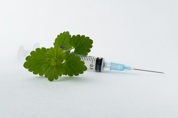 Wall Mural - medical syringe with a long needle for the treatment of diseases and beauty shots on a white background