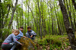 © Nenad - The children in the beautiful forest explore interesting plant and animal world.