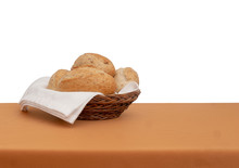Bread Basket. Wholemeal Brown Bread Rolls With White Cloth, Serviette Aka Napkin. Isolated Against White Behind.