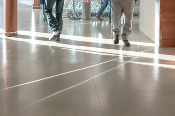 feet of men going on the floor of store