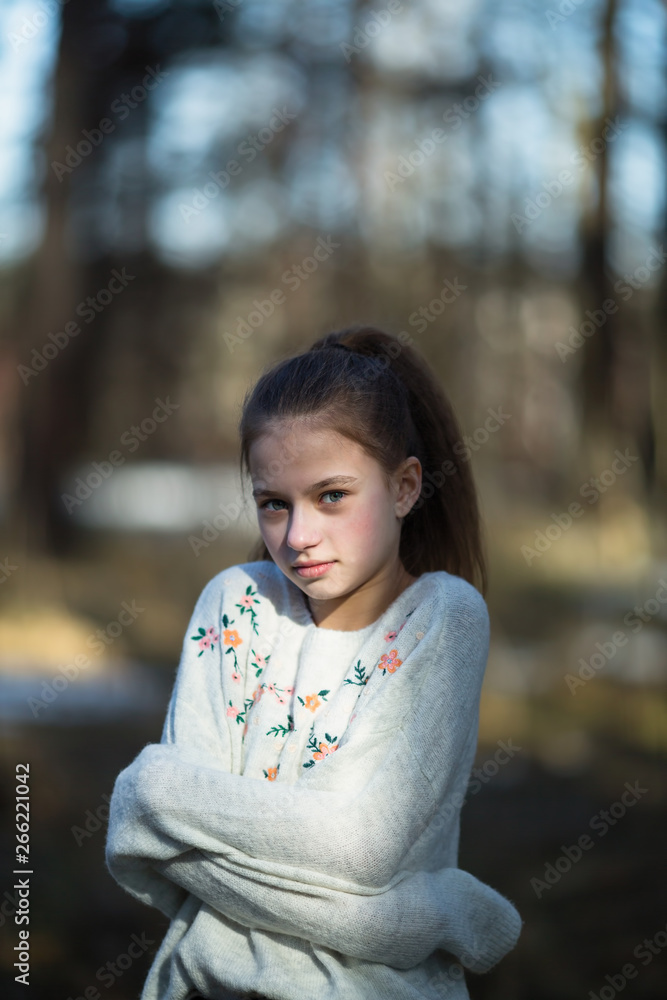 portrait-of-cute-twelve-year-old-girl-in-the-park-stock-photo-adobe