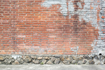 red bricks wall with gray cement