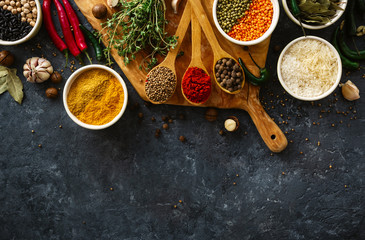 Wall Mural - Spices, herbs, rice and various beans and seasonings for cooking on dark backgraund with copy space top view