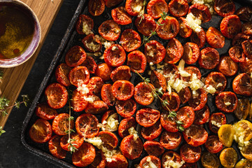 Canvas Print - Baked cherry tomatoes in baking tray top view