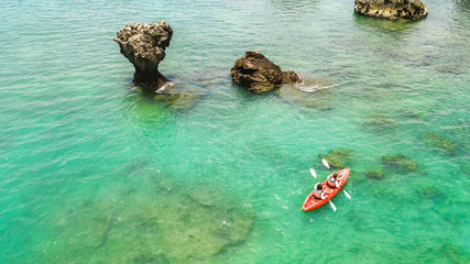 Wall Mural - Family kayaking, mother and daughter paddling in kayak on tropical sea canoe tour near islands, having fun, active vacation with children in Thailand, Krabi