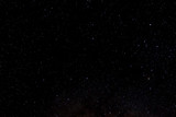 Fototapeta Sawanna - Stars and galaxy outer space sky night universe black starry background of shiny starfield