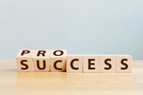 Process for success concept. Wooden cube block flip over word process to success on wood table
