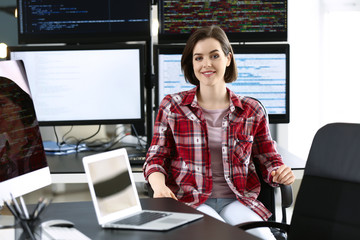 Portrait of female programmer in office