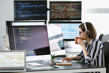 Female programmer working in office