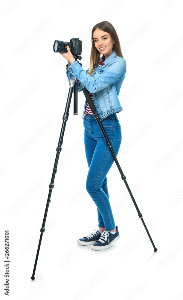 Young female photographer on white background