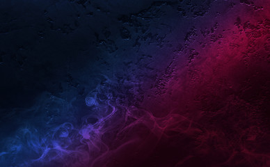 Empty background scene. Dark street, reflection of blue and pink neon light on wet pavement. Neon shapes. Rays of light in the dark, smoke. Abstract dark background.