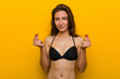 © Asier - Young european woman wearing bikini showing that she has no money.