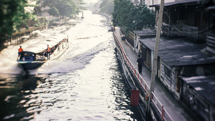 Wall Mural - walkway by khlong or canal in Bangkok, Thailand with sunlight in the morning, shallow depth of field