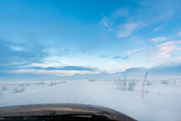 Wall Mural - driving eastward on a snow road from the russian city of murmansk, north of the polar circle