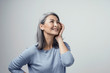 © Svyatoslav Lypynskyy - Side profile of charming asian woman smiling on white background