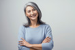 © Svyatoslav Lypynskyy - Smiling Asian senior woman with crossed arms