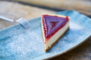 Delicious raspberry cheesecake on the table