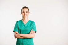 Cheerful Female Doctor In Green Uniform.