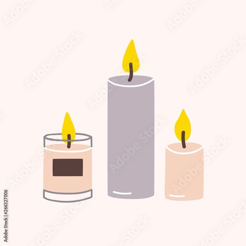Fotografía Burning wax or paraffin aromatic candles for aroma therapy isolated on light background