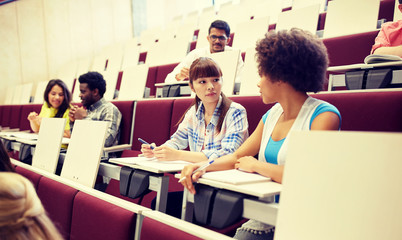 Poster - education, high school, university, learning and people concept - group of international students talking on lecture