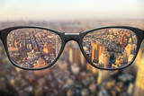 Fototapeta Nowy Jork - View through glasses sharp with glasses unsharp without glasses