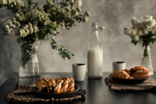 FRESH BAKED CROISSANT  ON THE BLACK TABLE AND RUSTIC BACKGROUND