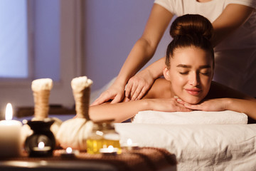 Wall Mural - Total Relaxation. Woman In Spa Salon With Herbal Bags On Foreground