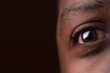 © rohane - close up of african american eye on dark brown background