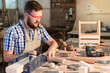 © pantovich - Working days of a professional carpenter in the workshop, a craftsman at his workplace