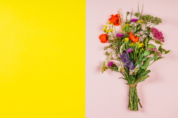 wild flower bouquet on pink and yellow background