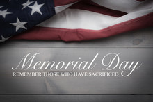 The Flag Of The United Sates On A Grey Plank Background With Memorial Day
