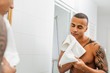 © Artem Varnitsin - Handsome man holding white towel with eyes closed after shaving