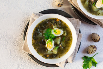 Canvas Print - Green Sorrel soup - a soup made from broth, sorrel leaves, spinach,  eggs (hard boiled), potatoes, carrots, parsley root. Polish, Ukrainian, Belarusian, Russian, Jewish dish.