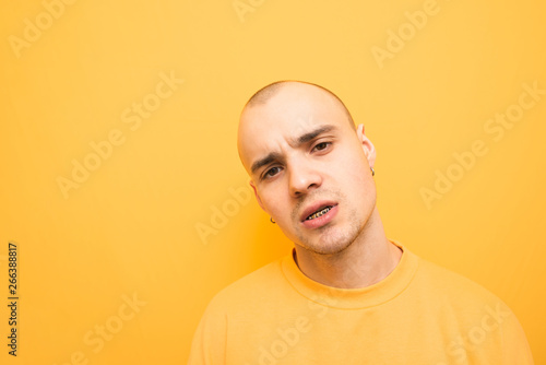 Stylish Male Rapper With Grillz On His Teeth Poses On A Yellow Background Wearing A Yellow Casual Sweatshirt And Balls Portrait Of A Cool Authentic Man Close And Bright Photo Buy