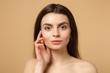 © ViDi Studio - Close up brunette half naked woman 20s with perfect skin, nude make up isolated on beige pastel wall background, studio portrait. Skin care healthcare cosmetic procedures concept. Mock up copy space.