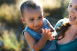© Rob and Julia Campbell/Stocksy - Young mom and son enjoying each other in sunshine