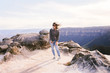 © Kayla Johnson/Stocksy - Brunette woman windswept on cliff
