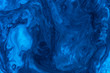 © Robert Kohlhuber/Stocksy - Abstract of blue paint in water
